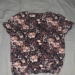 a shirt with flowers it’s kind of like a crop top